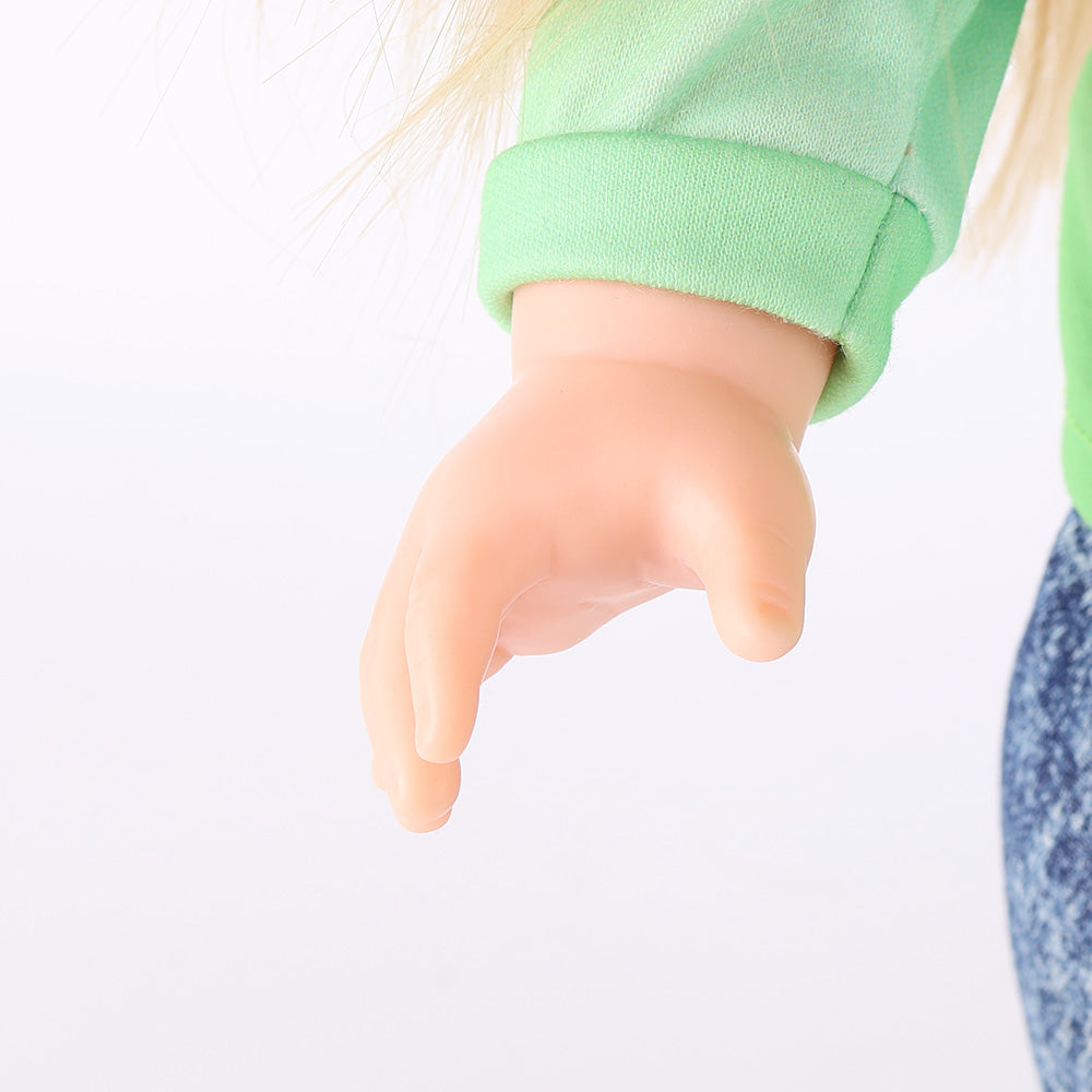 Close-up of Anna doll's articulated hand, with posable fingers designed to hold a paintbrush or pencil.