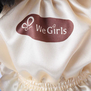 Detail shot of Wanru doll's light yellow puff-sleeve top, showing fabric texture and delicate button details.