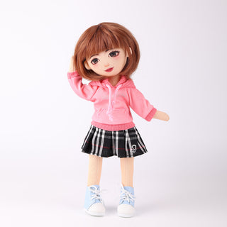 WeGirls Akiko cotton doll wearing pink hoodie and houndstooth pleated skirt - full front view