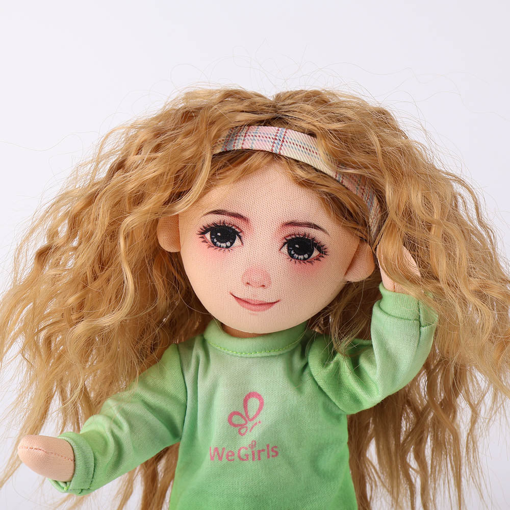 Close-up of Anna doll's golden curly hair and expressive facial features