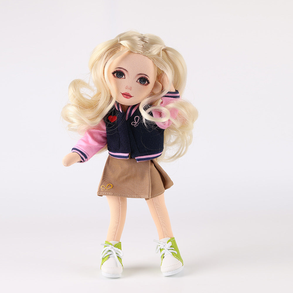 WeGirls Lucy doll in baseball jacket and brown pleated skirt - full front view