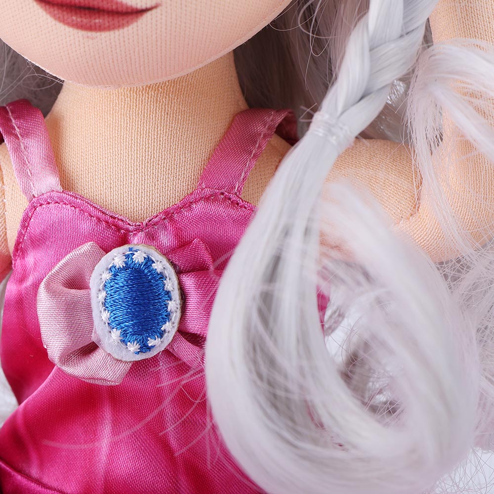 Close-up view of decorative embellishments on Natasha doll's dress