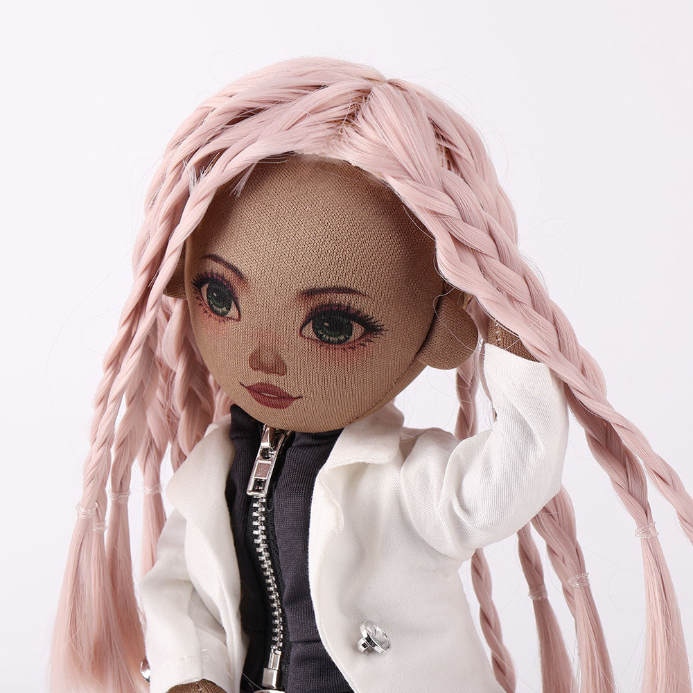 Close-up detail of Naya doll's unique pink braided hairstyle and facial features