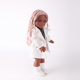 Side profile of the Naya doll showing the premium cotton body, flexible plastic joints, and detailed pink braided hair.