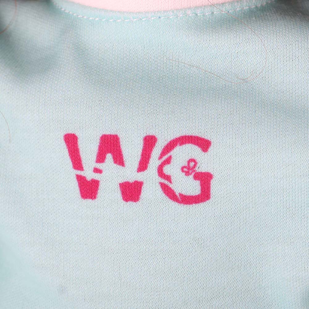 Close-up showing mint green tee fabric texture and print details on Yufei doll